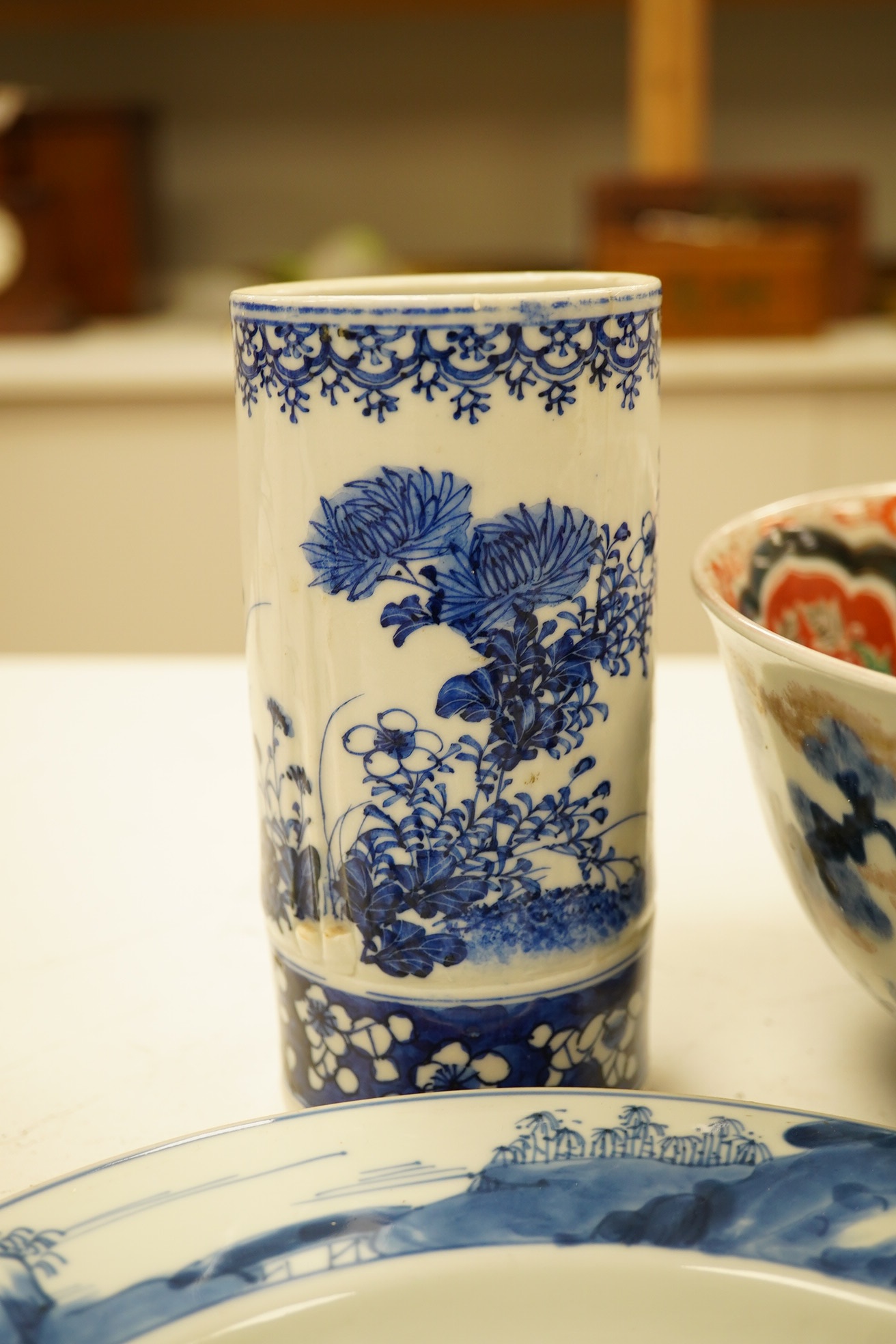 A pair of Chinese porcelain blue and white dishes, Kangxi, a pair of cylindrical vases and an Imari bowl (6). Condition - fair